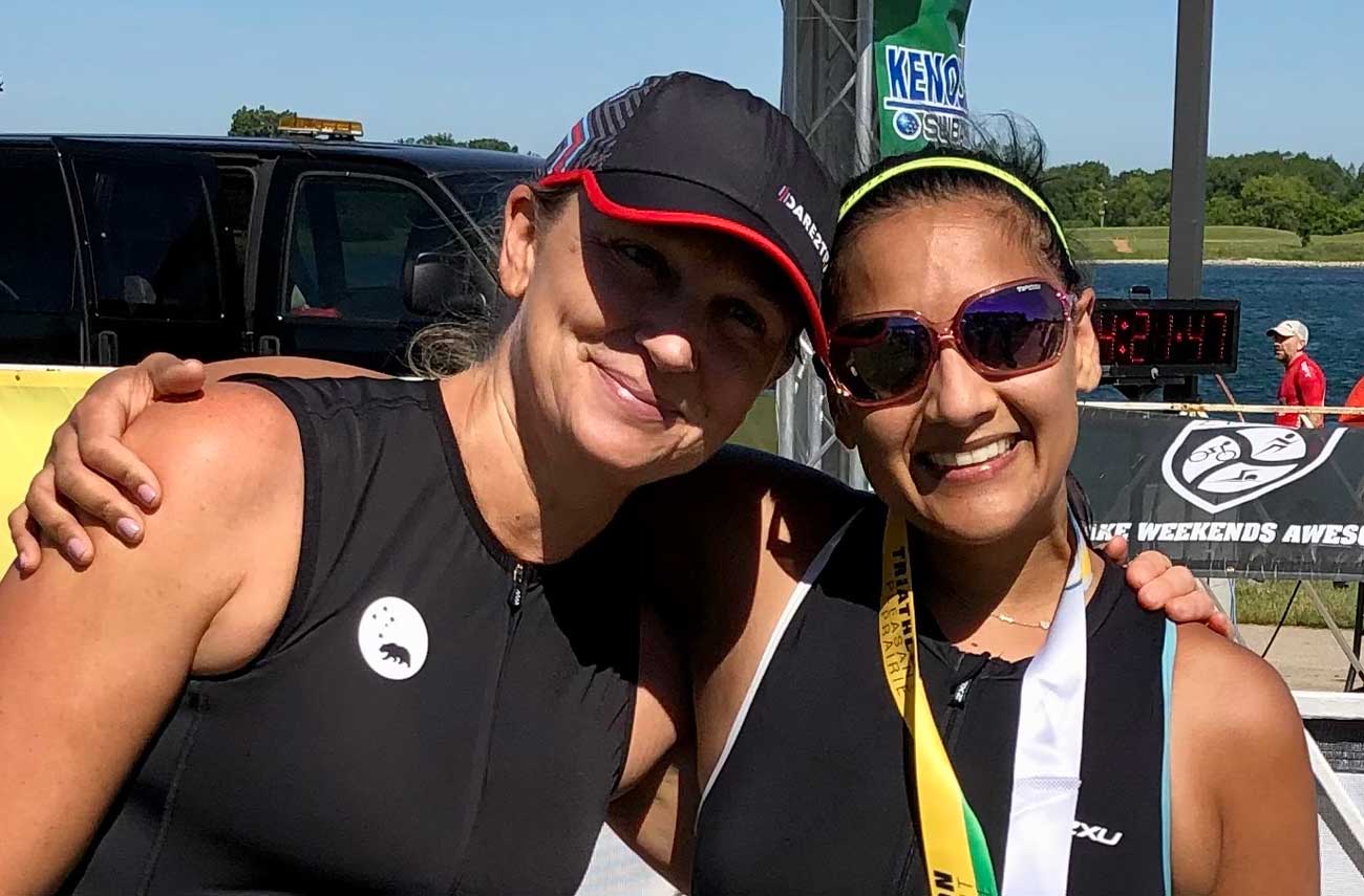 Sophia Shaw and Neha Gupta at a triathlon finish line